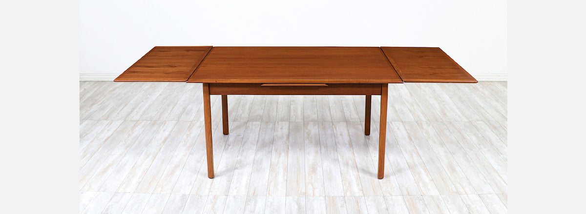 Danish Modern Expanding Teak Dining Table with Draw-Leaves